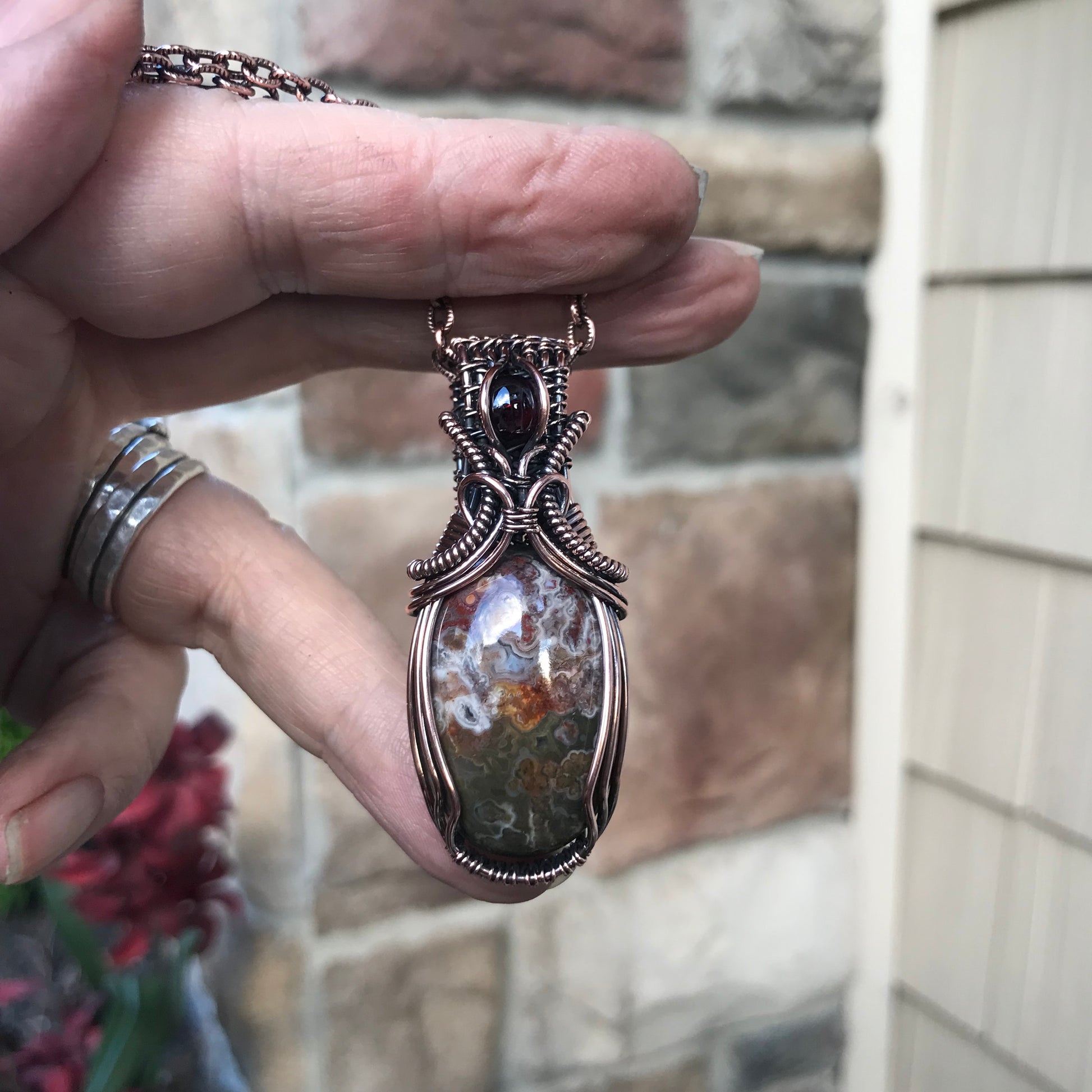 Oval Crazy Lace Agate & Garnet Woven Bail Copper Pendant