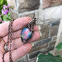 Aurora opal blue and green round copper wire wrapped pendant by Moonlet Jewelry