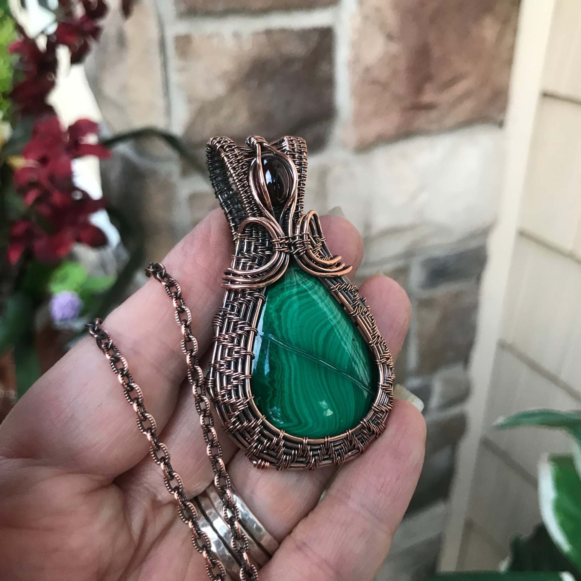 malachite copper wire woven pendant with garnet accent