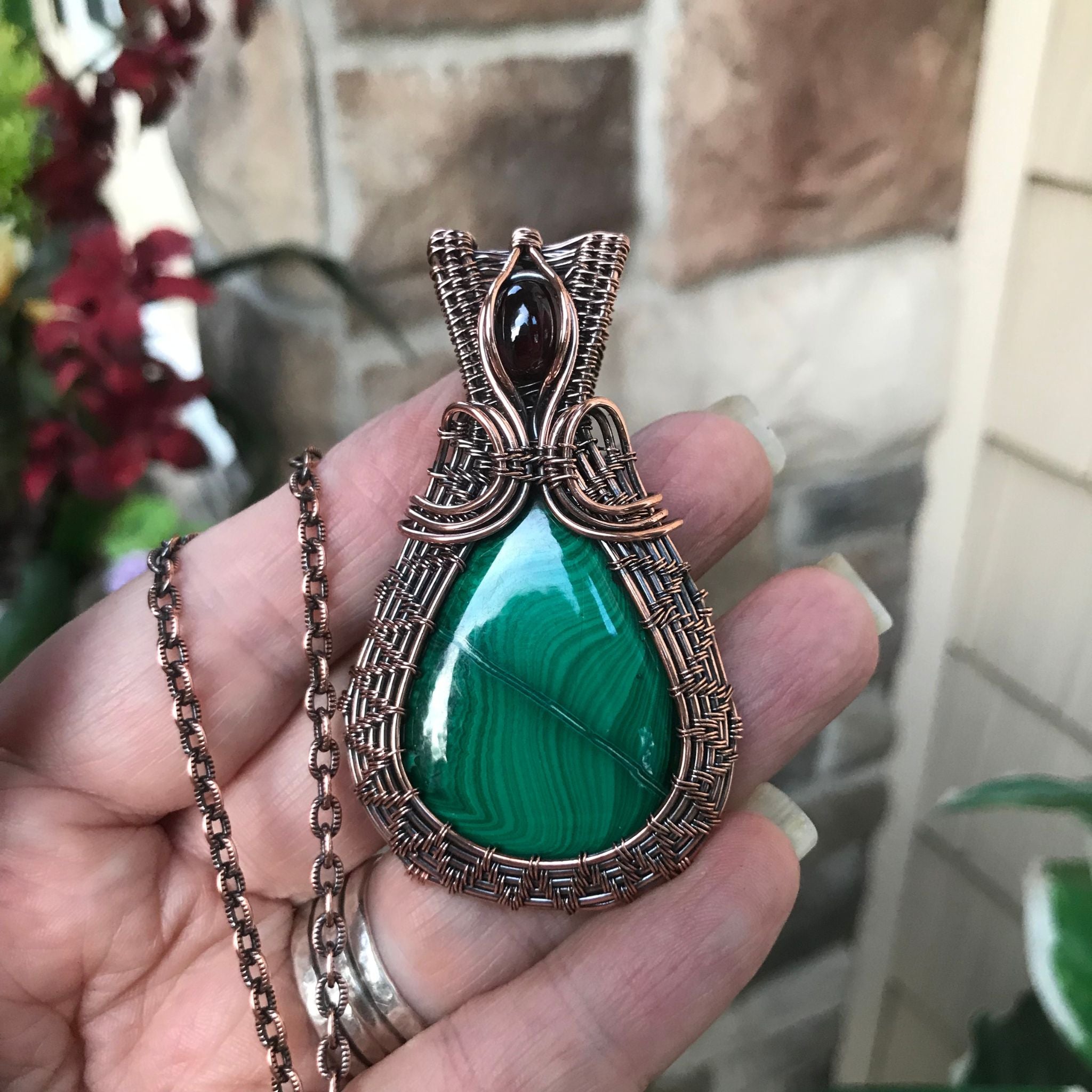 malachite copper wire woven pendant with garnet accent