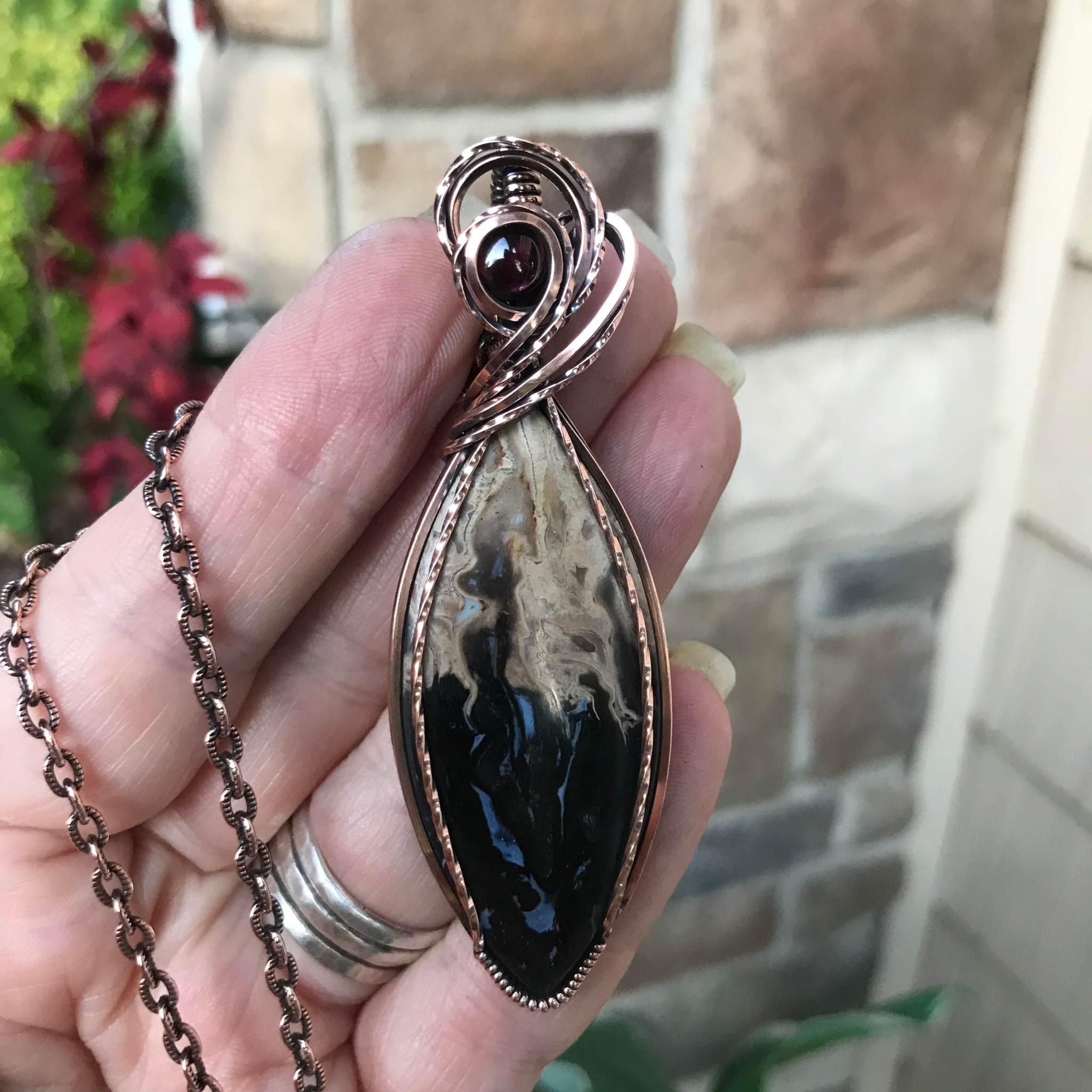 Petrified palm wood root marquis shaped copper wire wrapped pendant